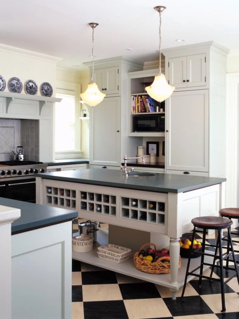 Homeowner Susan Opperman wanted to display her husband's passion for wine in a fresh, modern way. Her custom-constructed island safely houses 30 bottles of wine in a functional design without distracting from the kitchen's overall look. Design by Sally Ross Designs and Kenzer Furniture; Photo by George Ross Photographs