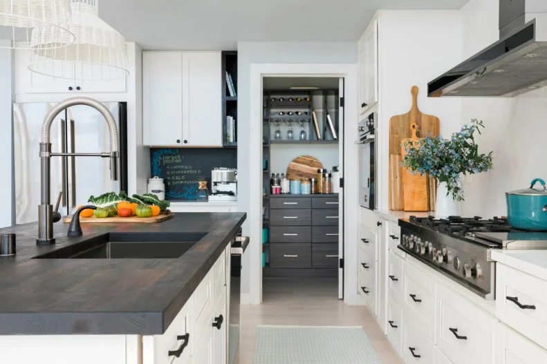The kitchen includes a new walk-in pantry that offers organized storage space for dry goods, serving plates, bowls and more. 