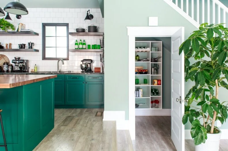 The spacious pantry under the stairs is a smart design that makes the most of what could be unused space. 