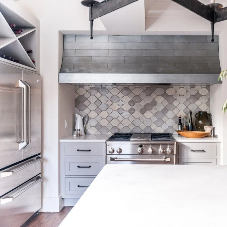 Amazing grays! In this kitchen, the backsplash above the range and the range hood use subtly different shades of the neutral with so-pretty results.