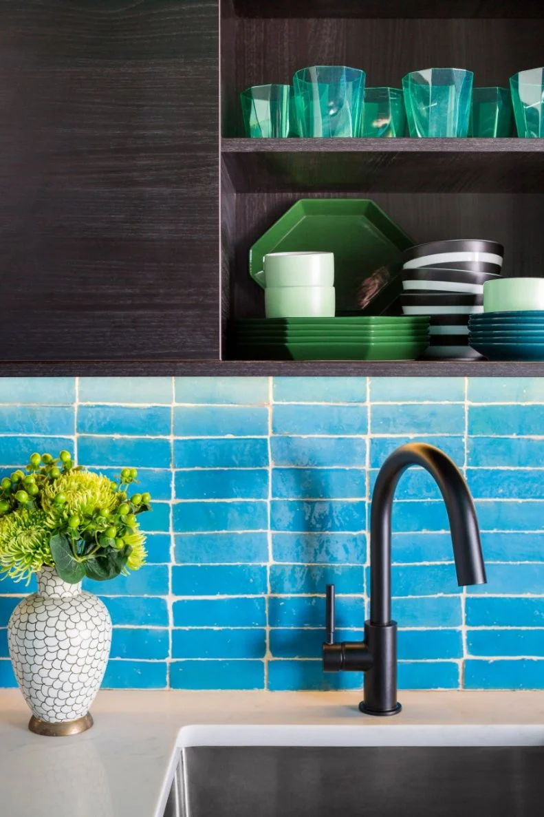 Upper cabinets with open shelves let the dishes' geometry and punchy colors be a vibrant part of the kitchen's look.