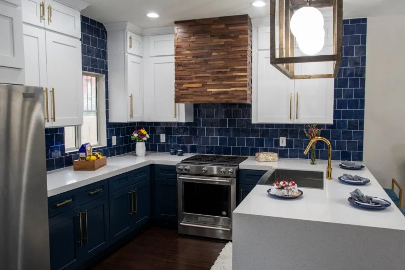 A modern blue kitchen with a blue tile backsplash is shown, as seen on HGTV's Flip or Flop Las Vegas. 