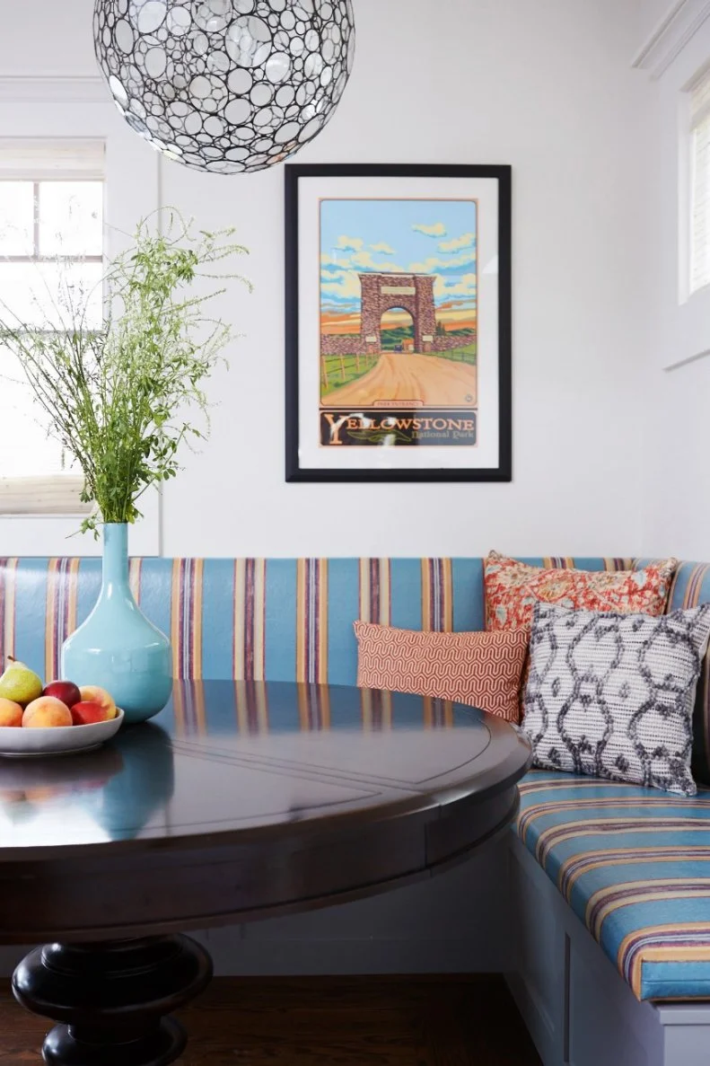 In the breakfast nook, designers create a space that popped by using a bold teal and brown striped vinyl fabric for the banquette cushion. By choosing this sort of fabric, the area gets an added bit of style and flair with the easy clean-ability of vinyl. 