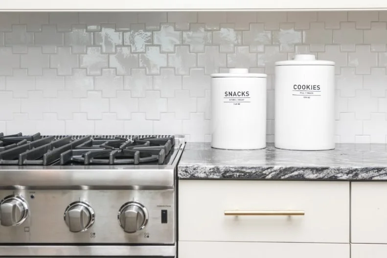 This kitchen livens up its backsplash with a twist on the classic subway tile: These tiles are in a fresh cross shape.