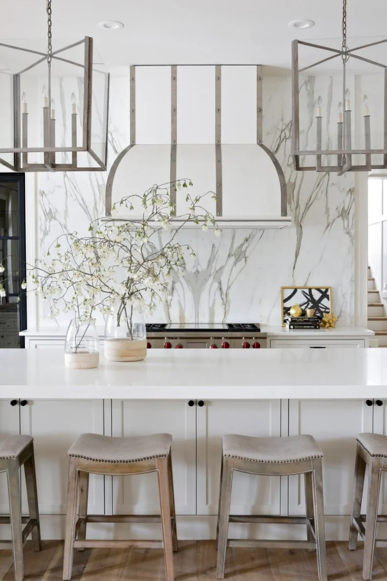 For a family who loves cooking and crafts, it made more sense to use marble for a backsplash than countertops. On the wall, the marble adds visual dimension and a crisp, elegant effect.