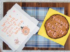 Jeff Mauro's son Lorenzo and Geoffrey Zakarian's children Madeline, Georgie, and Anna join the Kitchen hosts to share a Father's Day "dad joke" cookie cake, as seen on Food Network's The Kitchen