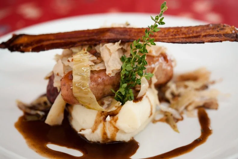 Step out of Epcot’s bustle into the Rose & Crown, and you’ll find a welcoming British pub serving elevated English fare. Go for old-timey United Kingdom favorites like scotch egg, shepherd’s pie, corned beef and cabbage, or bangers and mash, or embrace the new with chicken masala curry, pan-roasted Scottish salmon with kale, or a vegetarian “crumble” that’s a hot and satisfying entrée for the meat-free crowd. You must end your meal with sticky toffee pudding. Scotches, beers and wines will quench your thirst. Outdoors, grab a fish ‘n’ chips from the Yorkshire County Fish Shop and you’ll feel like you’re in, well, Yorkshire.