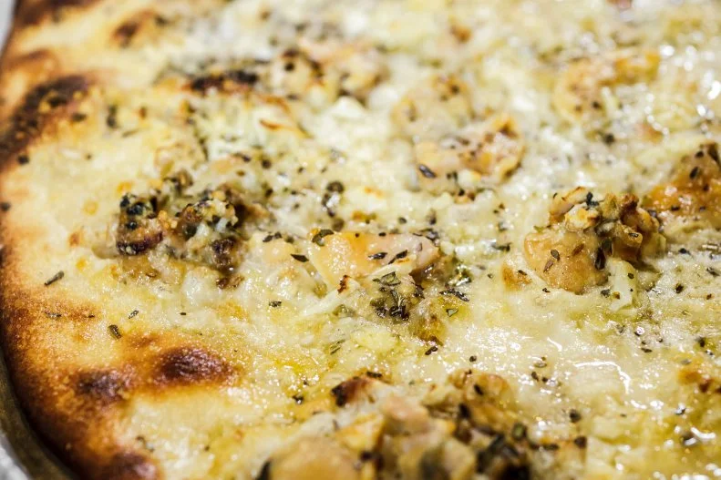 New Haven is a nice stop for those traveling along 95 between New York and Boston, especially if the plan is to eat a few slices of pizza. The city's signature style of coal-fired pie originated at Frank Pepe back in 1925, and the thin crust has now become the stuff of legend. You can't go wrong with any of the pizzas, but their most-popular is topped with fresh clams, grated cheese, olive oil, fresh garlic, and oregano. Devour it with a local Foxon Park soda, bottled right nearby.