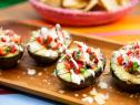 The hosts pass the Grilled Stuffed Avocados, as seen on Food Network's The Kitchen