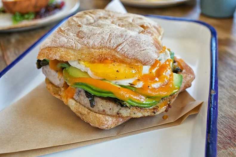 Right along Playa Del Rey Beach, Playa Provisions packs four concepts into one space: whiskey bar, ice cream shop, market counter and seafood restaurant. Brunch goes down at the latter, called Dockside, every Saturday and Sunday. This is where you'll find a glorious breakfast sandwich, stacked with turkey and bacon sausage, an over-easy egg, Gruyère, vinegar collards, avocado and a house-pickled habanero hot sauce on ciabatta bread.