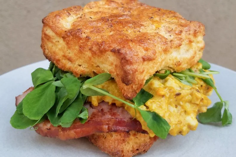 Australian cafe Paramount Coffee Project brought its owners' vision to Los Angeles with a location inside ROW DTLA. Breakfast sandwiches here get served on buttery biscuits, like The PCP Breakfast Sandwich with curried egg salad, lemongrass cured ham, tomato jam and pea tendrils on a salt-and-pepper biscuit.