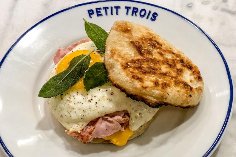 Ludo Lefebvre took his beloved Petit Trois concept and opened it in Sherman Oaks. At Petit Trois Le Valley, guests can expect the same Parisian feel of the original Hollywood location, but with more space and new menu items. One such dish is the Mec Muffin breakfast sandwich with Parisian ham, American cheese, egg and sage.