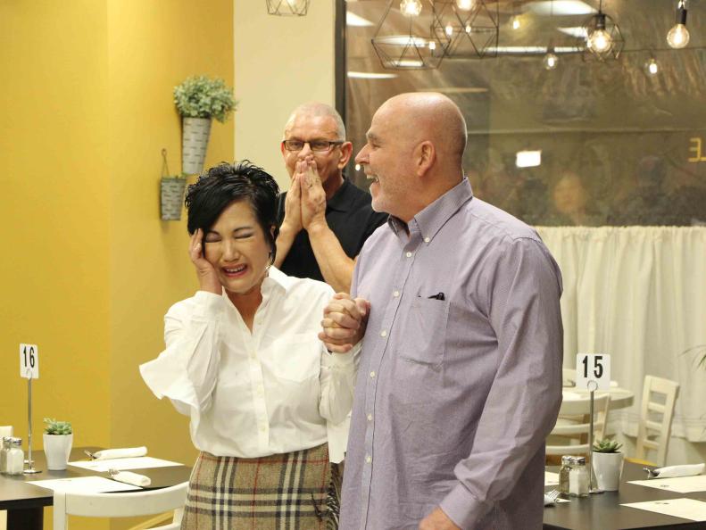 Robert and Don watch as Liz is overcome with emotion, as seen on Restaurant Impossible, Season 14.