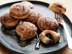 Ebelskivers--fluffy Danish-style stuffed pancakes--are even more fun when packed with blueberries and a lemony ricotta filling.