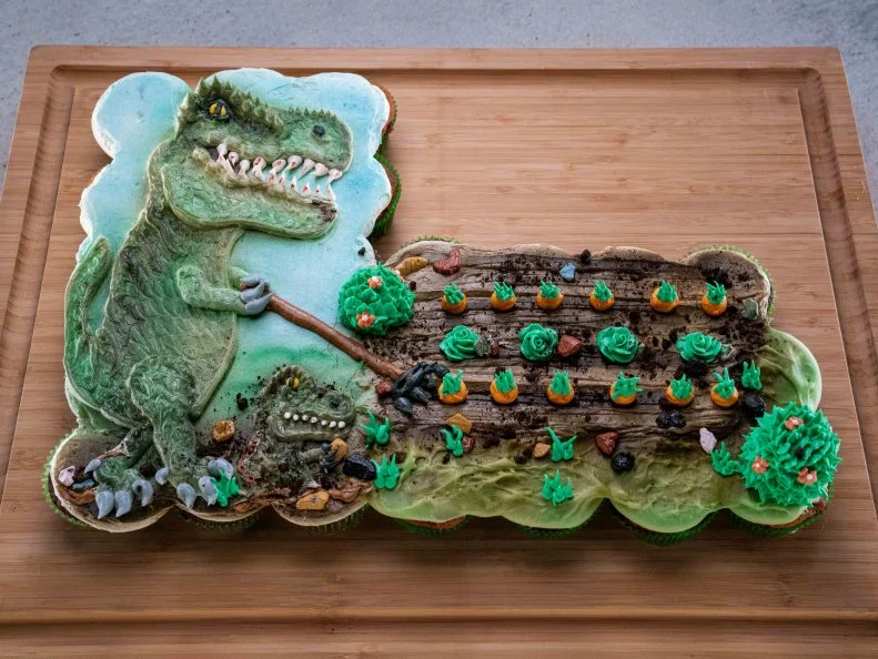 Contestant Anna Ubel's dish dinosaur farm pull apart during the final challenge, as seen on Cupcake Championship, Season 1.