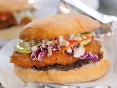 <p>When owner Edgar Delfin had trouble finding great-tasting vegan options in Texas, he created his own. Everything on the menu of this taco truck is 100% plant-based.<b> </b>Guy loved the<span> Milanese Torta:</span> Delfin makes his own seitan steak&mdash;a plant protein made from wheat gluten&mdash;which he then coats in panko and deep fries. The sandwich comes together on torta bread by stacking a layer of black beans, the fried seitan patty, cabbage and fresh tomatoes, and is topped with avocado crema and vegan mayo. Even as a meat lover, Guy was impressed: &ldquo;You get such great texture in that seitan,&rdquo; he said.</p>