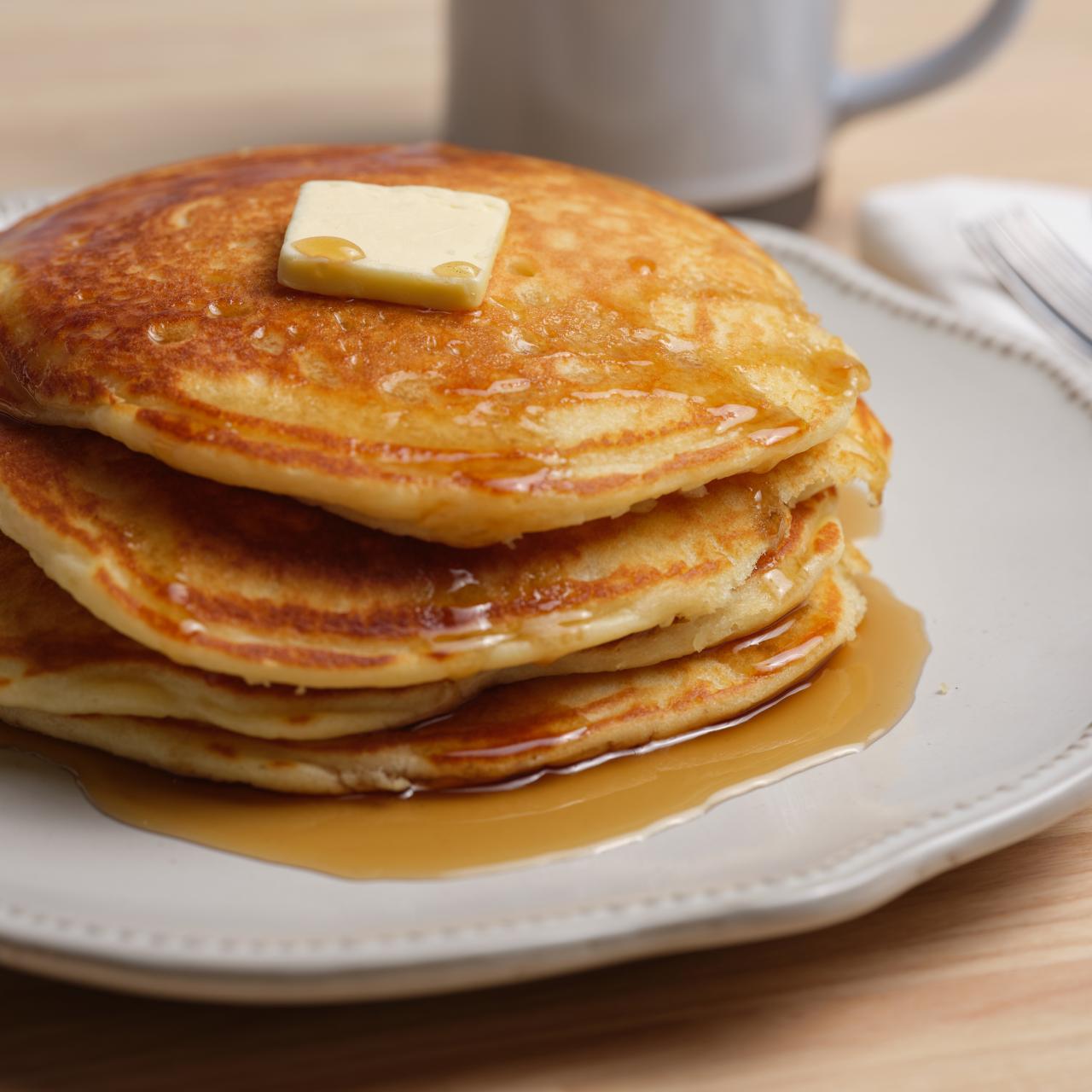 https://food.fnr.sndimg.com/content/dam/images/food/fullset/2019/7/11/0/FNK_the-best-pancakes_H_s4x3.jpg.rend.hgtvcom.1280.1280.suffix/1562853903667.jpeg