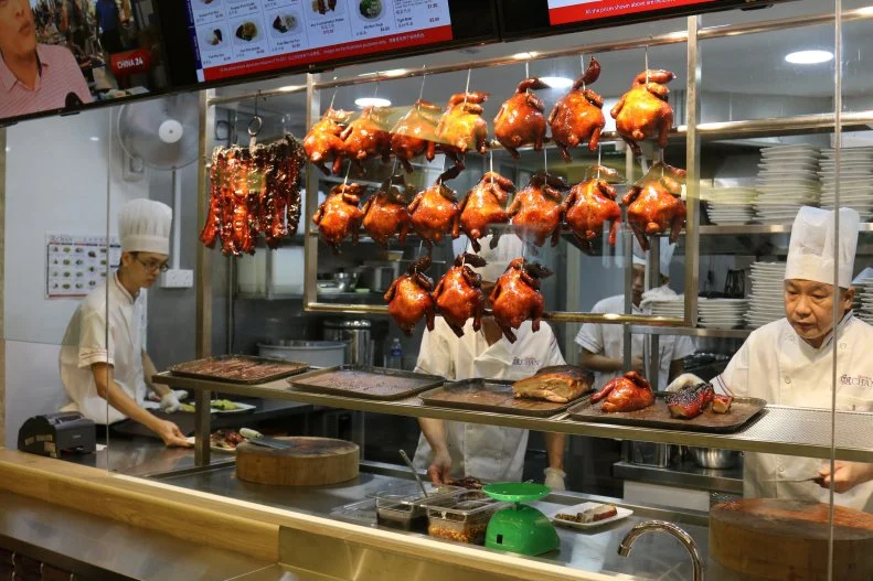 In 2016 Chef Chan became the world’s first hawker to be awarded a Michelin star. Since then, this small food stall has expanded to 15 restaurants in six countries around the world. To get the original Hong Kong Soya Sauce Chicken Rice & Noodle, visitors can line up in the Chinatown Complex. But save yourself an hour or two and head to one of his new Singapore locations. It will be the cheapest Michelin star meal of your life.