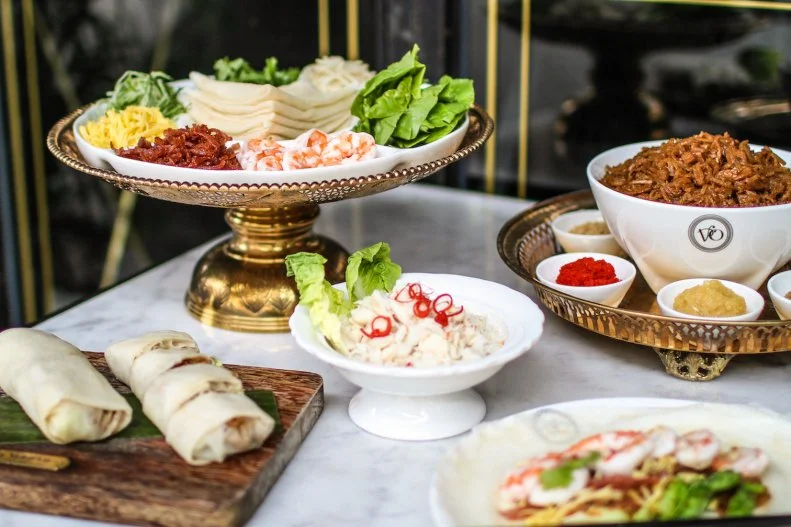 There are several locations of Violet Oon Singapore, including at the new Jewel Changi Airport. Dedicated to home cooking and quality spices, the popular Peranakan and Singaporean mini-chain serves classic dishes like Kuay Pie Tee and Nyonya Poh Piah in a setting with elaborate, colorful Peranakan touches.