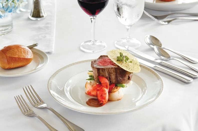 With an expanding fleet of 11 ships sailing North America’s waterways, American Cruise Lines is the largest cruise line in the United States, offering 35 itineraries in more than 25 states for 100 to 200 passengers. Chefs focus on the season and region where they’re cruising and use local ingredients wherever possible. Generally featured on every sailing of five to 22 days, their classic Surf & Turf features roasted tenderloin of beef, Maine lobster claws, pan-seared scallops and grilled asparagus.