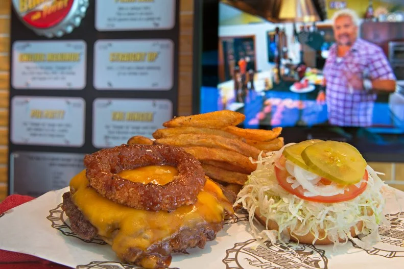 Poolside burgers are popular on many ships, but leave it to the Fun Ship® folks at Carnival to up the ante with Guy Fieri for next-level combinations. Paired with fresh-cut fries, a tasty toppings bar and Carnival’s own beers, the Fieri-curated burgers (including the Pig Patty and a version topped with a huge onion ring) make this a popular joint come lunchtime. Plus, Carnival Cruise Line  kicks it up another notch on their new ship, Mardi Gras with Emeril Lagasse’s New Orleans-inspired concept, Emeril’s Bistro 1396.
