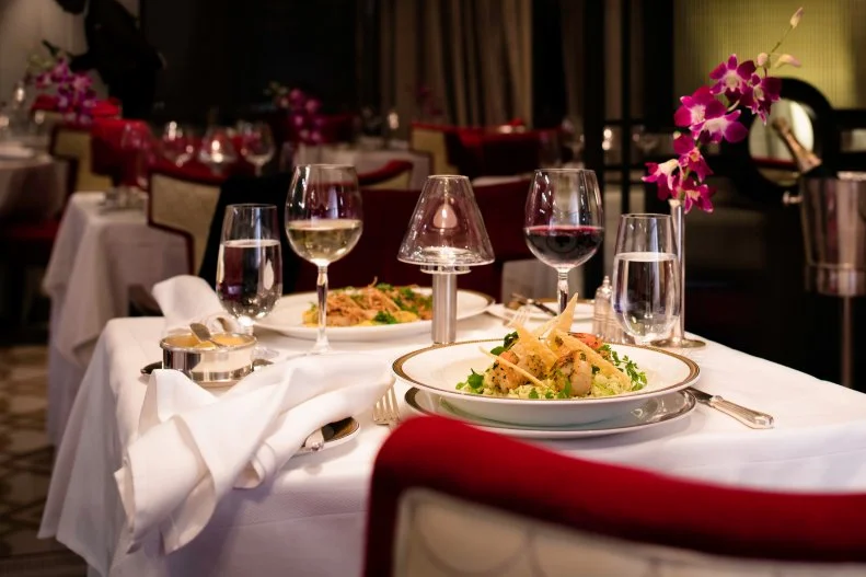 With regal ships and a previous-passenger list that includes many generations of royals, Cunard knows how to treat passengers like royalty. All three ships feature separate dining rooms called the Queens Grill and Princess Grill, reserved for those who have booked larger and more luxurious suites. Each dining room has its own menu, and Grill chefs are happy to tweak any dish or even cook something off-menu with advance notice. British and continental influences are prominent, including a variety of seafood dishes, Romney Marsh lamb, chateaubriand, roast duckling and crepes Suzette (flambéed tableside). And, of course, while many lines host high tea at sea, Cunard may do it best.