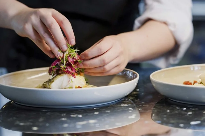 Though they now cruise around the world (including to Antarctica), Hurtigruten’s roots, heart, soul and stomach are in Norway. Focusing on adventurous coastal Norway destinations, the line and its chefs are dedicated to procuring and preparing locally produced, raised and caught ingredients. They work with local suppliers along the entire coast, meaning passengers can anticipate lamb from Geiranger, king crab from the Barents Sea, fresh Norwegian clipfish, cheese and fresh cod from Lofoten, reindeer from Finnmark and apples from Hardanger.
