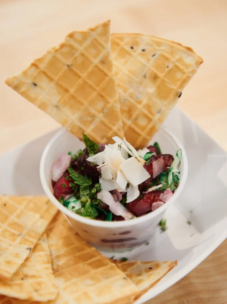 Contestant Cody Vasquez's dish "Pizzelle 'Chips' and Red Cherry and Green Grape 'Salsa'" for the challenge "Dessert Imposters" as seen on Food Network's Kids Baking Championship, Season 1.