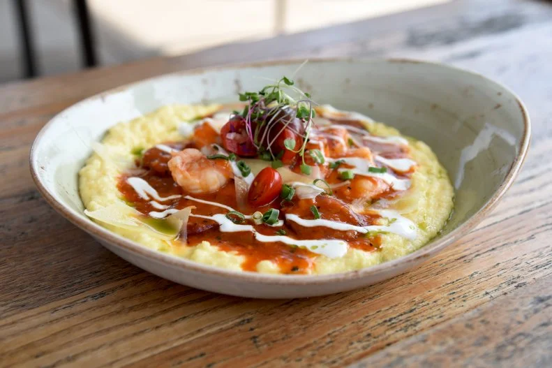 Come for the views, stay for the food at this 8th-floor rooftop that overlooks downtown Greenville. Before cozying up by a fire pit to watch the sunset, indulge in rooftop risotto made with seasonal vegetables and parm, or their shrimp and grits with creamy mascarpone polenta and andouille. There’s often a fun theme night or collaboration dinner going on, which are a great excuse to enjoy the mild temperatures of the South year-round.