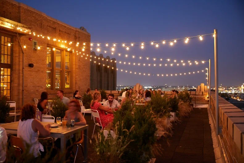 For a neighborhood spot with funky style head to the 8th floor of the historic Bok building in the heart of Philadelphia, where you’ll find Irwin’s. The eclectic space is filled with graffiti from the original space and vintage furniture. The menu pulls from various parts of the Middle East with dishes like za’atar-roasted eggplant and chicken and feta handpies. There’s plenty of greenery inside, but venture to the intimate rooftop to enjoy your meal under twinkling lights with views of downtown Philly.