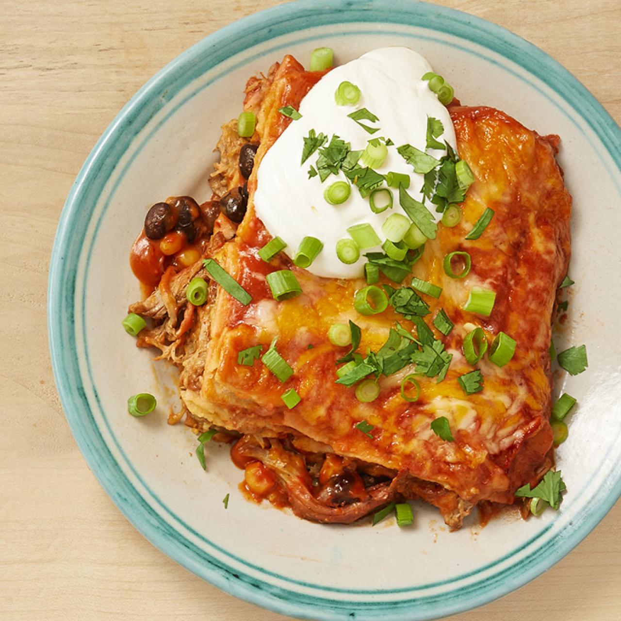 https://food.fnr.sndimg.com/content/dam/images/food/fullset/2019/7/31/0/FNM_090119-Pulled-Pork-Enchilada-Casserole_s4x3.jpg.rend.hgtvcom.1280.1280.suffix/1564582809873.jpeg