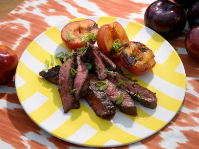 Grilled teriyaki steak and plums, as seen on The Kitchen, Season 22.