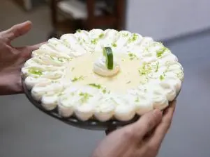 Host Jason Smith, with Contestant Melody Pfeffer, finishing her Key Lime Pie, as seen on Worst Bakers in America, Season 2.