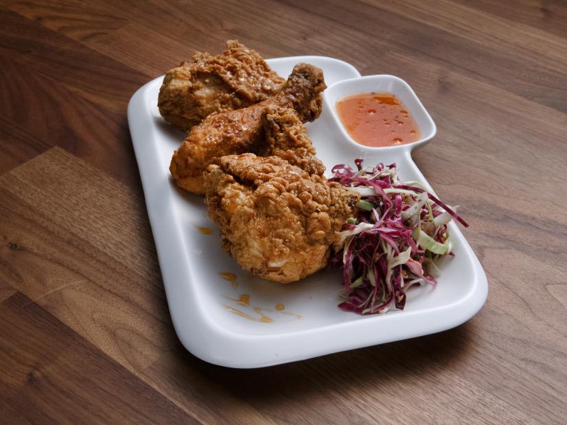 Bobby Flay's Fried Chicken with Honey Hot Sauce and Coleslaw is displayed, as seen on Worst Cooks in America, Season 17.