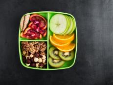 Healthy fruits and nuts snack box with oranges, apples, kiwi,walnuts, hazelnuts, and crackers viewed from above (Healthy fruits and nuts snack box with oranges, apples, kiwi,walnuts, hazelnuts, and crackers viewed from above, ASCII, 112 components, 11