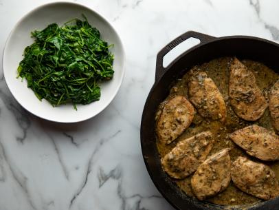 Close-up of Mustard Herb Chicken Cutlets and Garlic Spinach, as seen on The Pioneer Woman, Season 23.