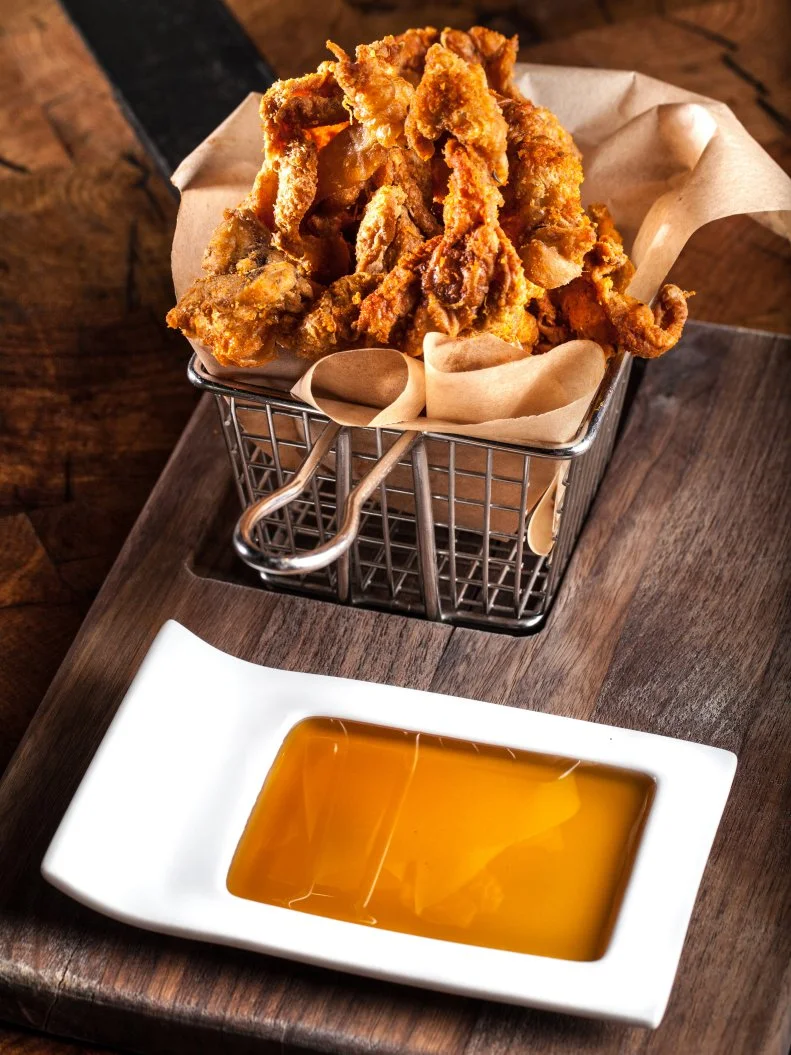 Just off the strip in downtown Las Vegas, Carson Kitchen is a step back in time to the 1950s, where social plates and innovative comfort food come together. While Vegas is filled with fancy restaurants, folks appreciate the laid-back vibe and, of course, the crispy fried chicken skins served with a mouthwatering smoked honey sauce for double dipping.