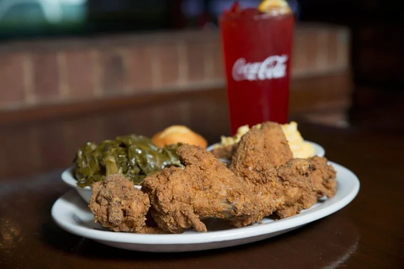 In Columbia, Kiki’s Chicken and Waffles is home is home to some of the best soul food in the state, fried chicken included. The signature dish, four fried chicken wings, epically seasoned and served on a Belgian waffle, is the way to order, but you really can’t go wrong here.
