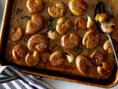 Somewhere between oven-roasted potatoes and crispy hash, these little creamer potatoes are boiled in water with baking soda before being smashed. The alkaline in the baking soda helps the skins crisp up quickly. Smashing increases their surface area and contact with the pan. The result is the crunchiest-ever crust.