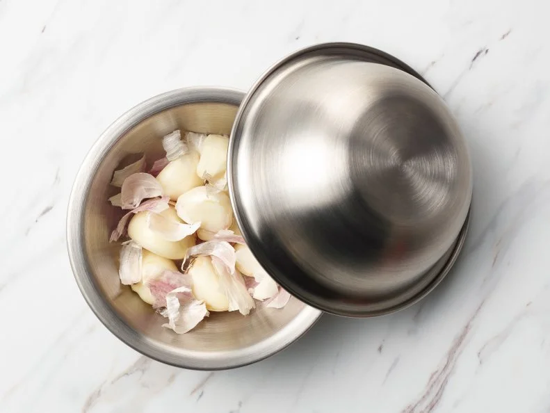 Food Network Kitchen’s TESTED COOKING HACKS GALLERY - Shake Off Garlic Peels, as seen on Food Network.
