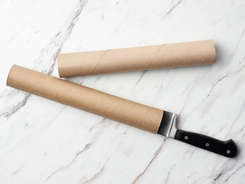 Food Network Kitchen’s TESTED COOKING HACKS GALLERY - Store knives and transport them safely in a paper towel tube, as seen on Food Network.