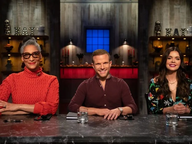 Posed group shot of Judges Carla Hall, Zac Young, and Katie Lee as seen on Halloween Baking Championship Season 5 Episode 2.