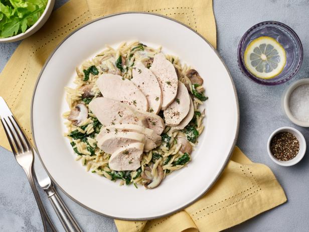 Food Network Kitchen’s Instant Pot Lemon Frozen Chicken with Orzo, as seen on Food Network.