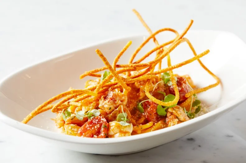 Chefs Michael Mina and Adam Sobel have been expanding their footprint of coastal Italian cuisine across the United States with locations of Cal Mare on both coasts. At the MGM Springfield, the duo blends Italian technique and inspiration with New England seafood. You’d be right to assume there’s an excellent lobster pasta on the menu. Modeled off a dish that could easily be found in Positano and the Amalfi, saffron spaghetti with lobster is bright and vibrant with lots of spice and basil. It features a combination of fresh and fried (not dried) pasta, offering an interesting textural contrast between the crunchy golden strands and the regular boiled al dente spaghetti with flavors that burst in your mouth.