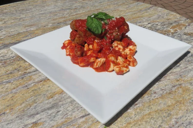 Located in pizza-loving New Haven, Connecticut, has been serving cavatelli and braciole to locals since 1938. Annunziata Consiglio featured the dish on the menu at her first restaurant with her husband, Salvatore, The Big Apple, before the couple were forced to relocate in the 1960’s, when they changed the name to the current Consiglio’s. Just like Annunziata learned in her hometown of Amalfi, Italy, ricotta pasta is still hand-rolled, one-by-one off a fork at the third- and fourth-generation owned family restaurant. It’s paired with thin-sliced beef, rolled and seasoned with parmesan cheese, garlic, basil and other spices, slowly simmered until tender in fresh tomato sauce.