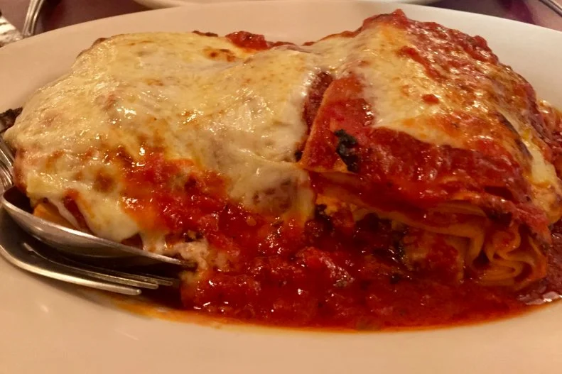 Since 1962, folks have lingered along Arthur Avenue — New York’s real Little Italy — on Sunday afternoons awaiting seats at Dominick's communal tables for a taste of the once-a-week lasagna. Every Sunday morning, the restaurant prepares trays of perfect layers of pasta with ground beef, ricotta, mozzarella and tomato “gravy.” What they refer to as gravy is sweeter than their marinara or tomato sauce (which is infused with garlic), featuring onion as the main flavoring component along with meatballs. The dish is totally worth a trek and a wait, but it’s wise to arrive when it opens around 1 p.m., as it often sell out within a couple of hours.
