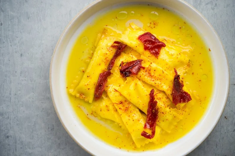Chef Missy Robbins has some of the deftest pasta-making hands in the United States. Fans — including megafans the Obamas — were crushed when she left A Voce in 2013. But she set up shop across the East River at Lilia luring diners to North Brooklyn for her now-iconic sheep’s milk agnolotti. Supple dough serves as a vibrant yellow case for pillowy sheep’s milk ricotta and feta cheese. Each one is rolled in melted butter with honey and saffron threads, offering a subtle perfume that is perfectly contrasted by bright sun-dried tomatoes. As wonderful as that dish is — it’s a mandatory order if you go — Robbins’ other pastas are equally delicious and deserving of a carb bonanza.