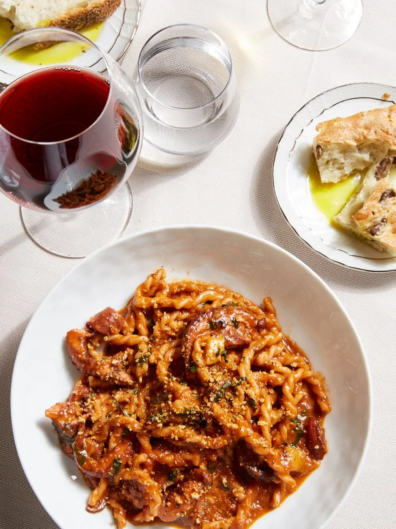 It wouldn’t be surprising if there were love songs dedicated to Chef Michael White’s famous fusilli with red wine-braised octopus and bone marrow at Marea. The dish, a totally American creation, is essentially a tribute to surf and turf combined with Italian-American Sunday gravy. Baby Octopus from Spain is braised in a mix of Sangiovese wine, San Marzano tomatoes, garlic and basil to create the sauce. When an order comes through, it gets reheated with seasoned, sauteed bone marrow, which thickens the lot and helps the sauce bind to both the octopus and the rope-like strands of the homemade fusilli. A toasted breadcrumb topping adds a satisfying crunch to the al dente dish.