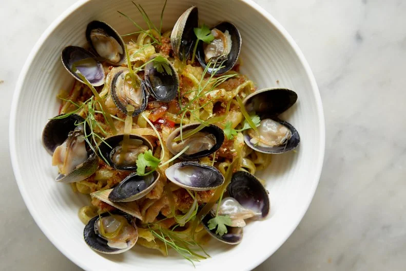 This Portland restaurant, by long-time fine-dining chefs Damian Sansonetti and Ilma Jean Lopez, serves rustic, seasonal fare inspired by the humble and flavorful cuisines of Southern and Central Italy with a focus on Calabria and Abruzzi and ingredients that fuse local bounty with imports from the motherland. One of the house specialties is the truly unique Maine kelp fettuccine, a briny seaweed-infused pasta, reminiscent of classic linguine with clam sauce, with mild Manila clams, fennel, onion and garlic in a vibrant dish that pairs Maine’s local bounty with coastal Italian cooking techniques.