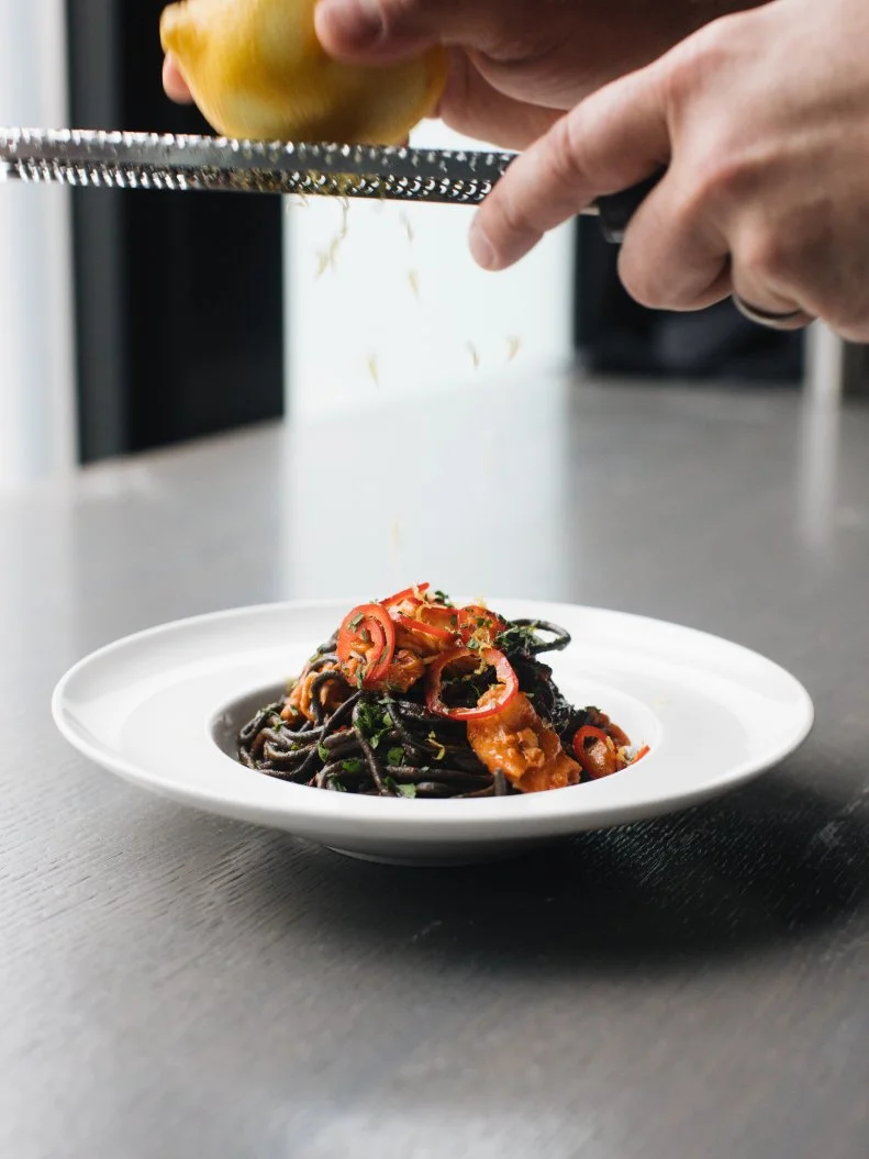 This Chicago Italian restaurant — with a second location in Washington, D.C. — is backed by Giuliana and Bill Rancic, but RPM Italian doesn’t rely on celebrity associations and its dining room packed with beautiful people — each is a destination-worthy restaurant. The food, especially the pasta, is really darn good even without the reality star endorsement. Chef-partner Doug Psaltis serves dozens of fresh pastas, made in-house every day, including really great homestyle Bolognese and pomodoro, but the one that stands out most in flavor — and aesthetic — is the spicy king crab with jet black squid ink spaghetti and vibrant Fresno chile.